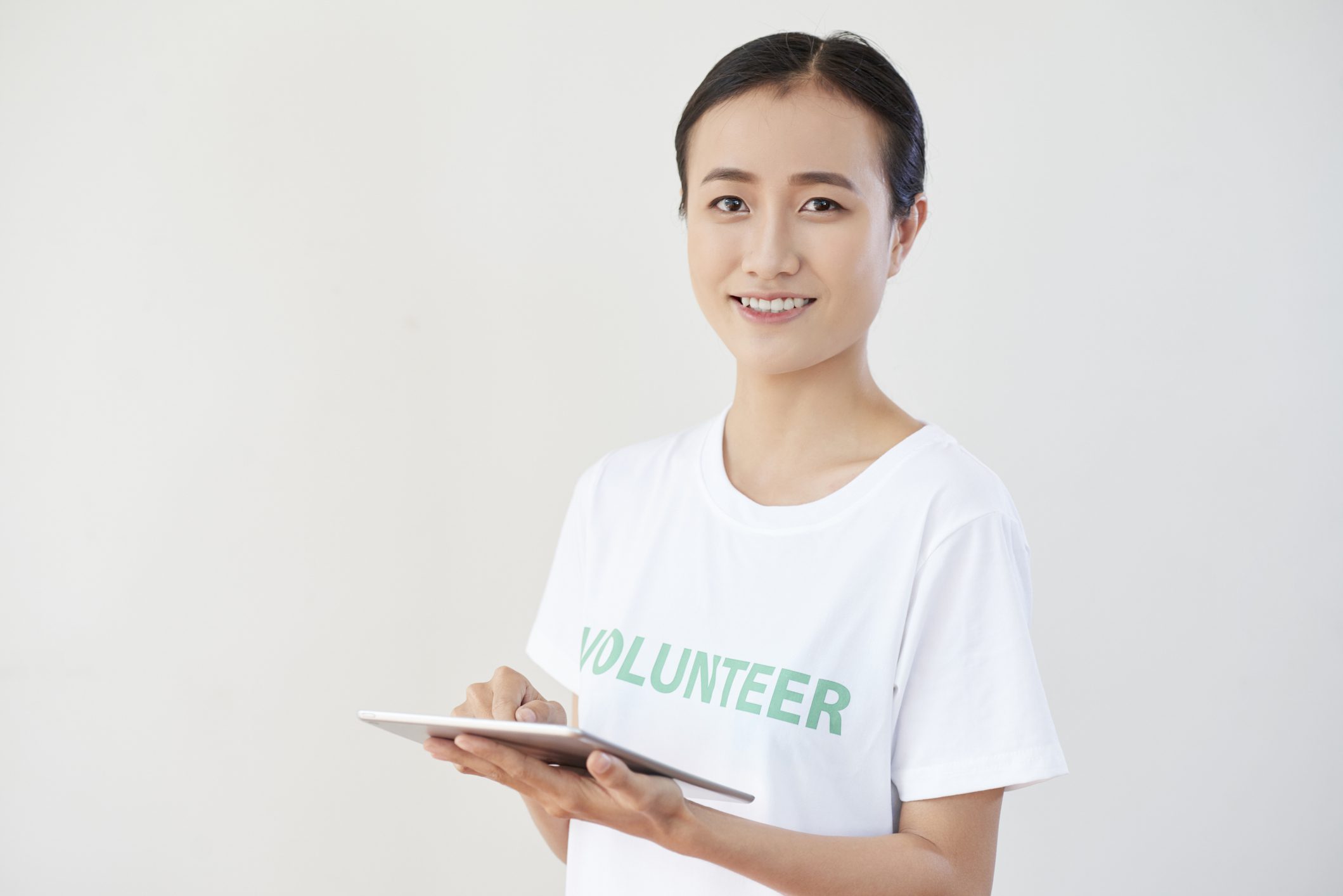 Volunteer using a tablet device