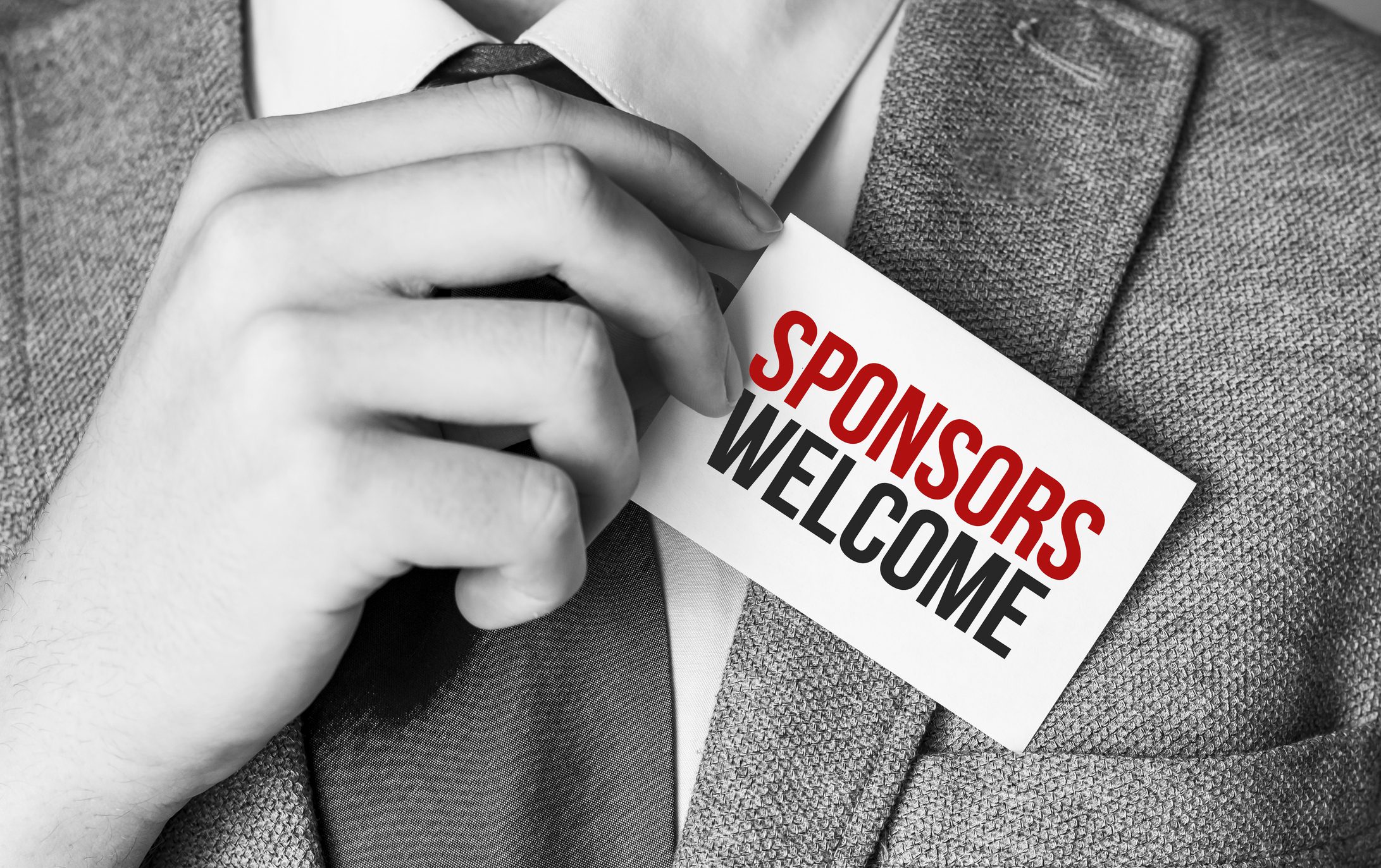 Grey suit with sponsor invitation card
