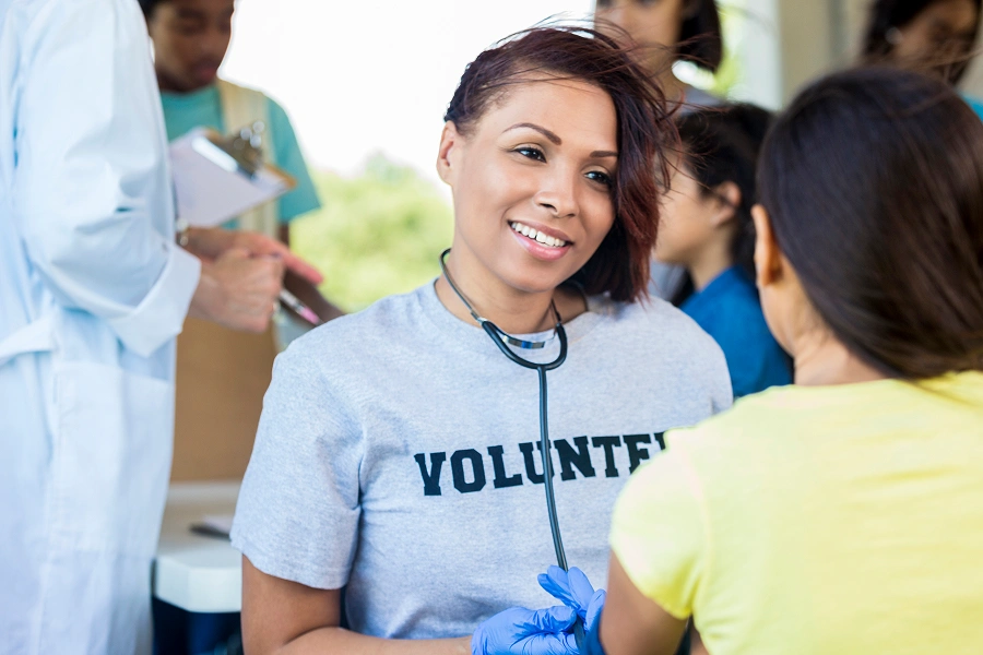 Woman volunteer in medical setting