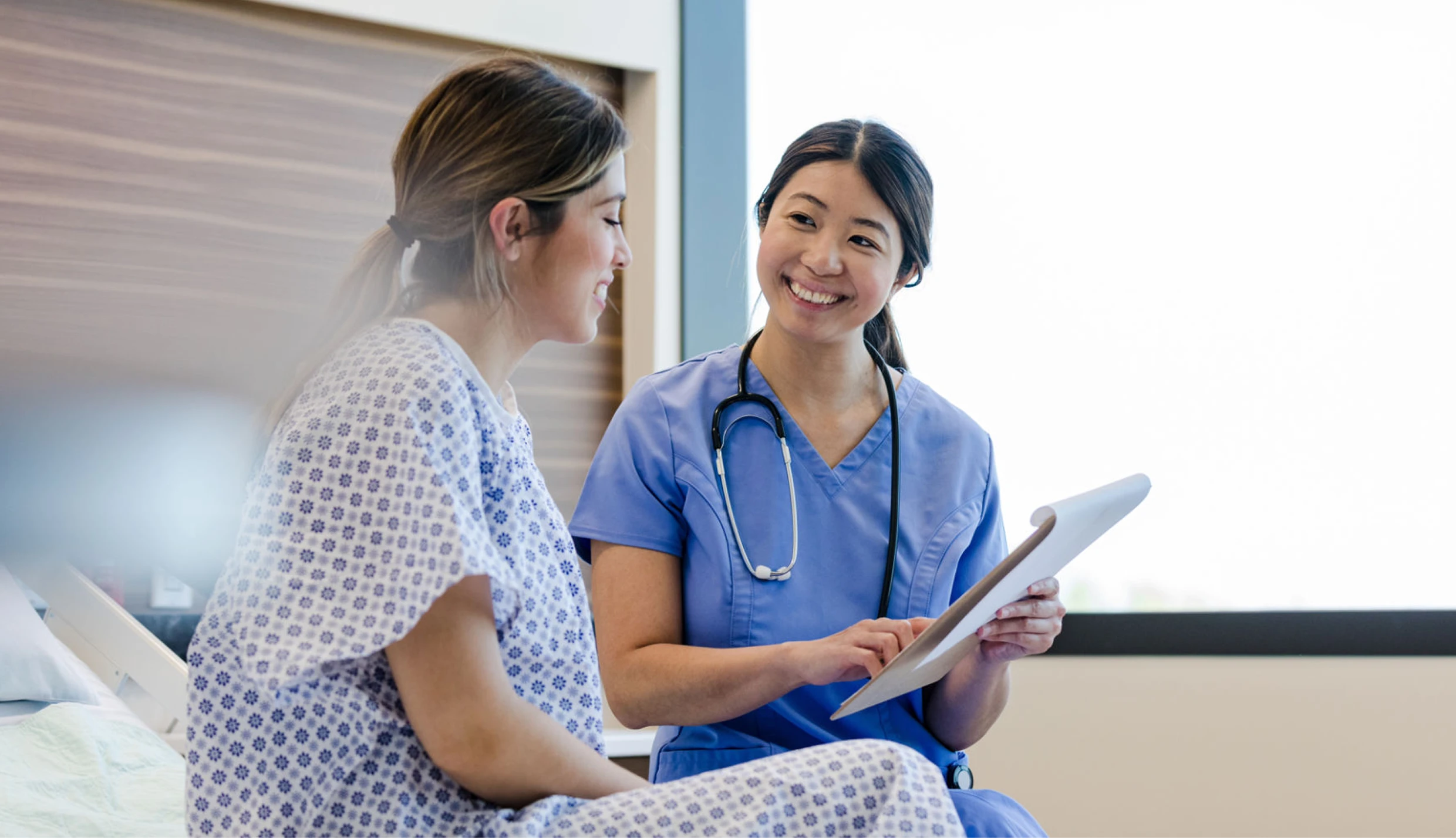 Nurse discussing medical report with patient