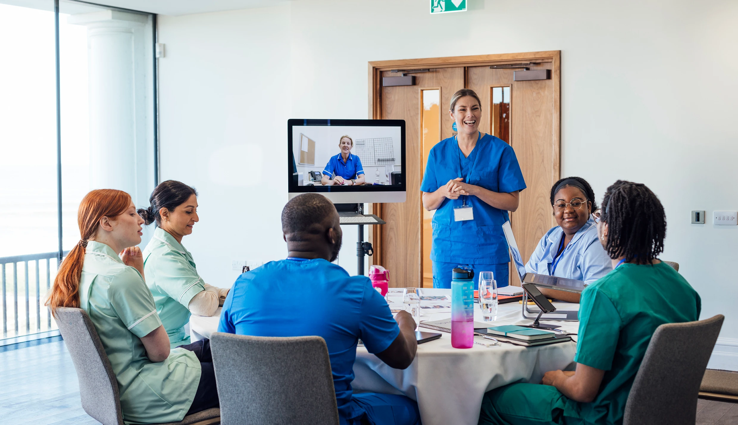 Medical professionals discussing around a table