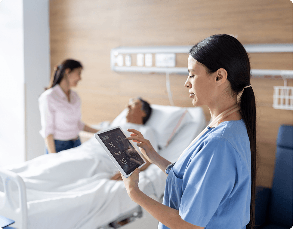 Hospital staff monitoring patient condition